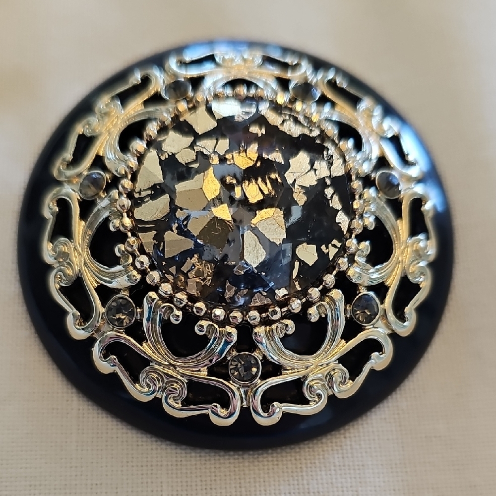 Elegant Black and Gold Brooch